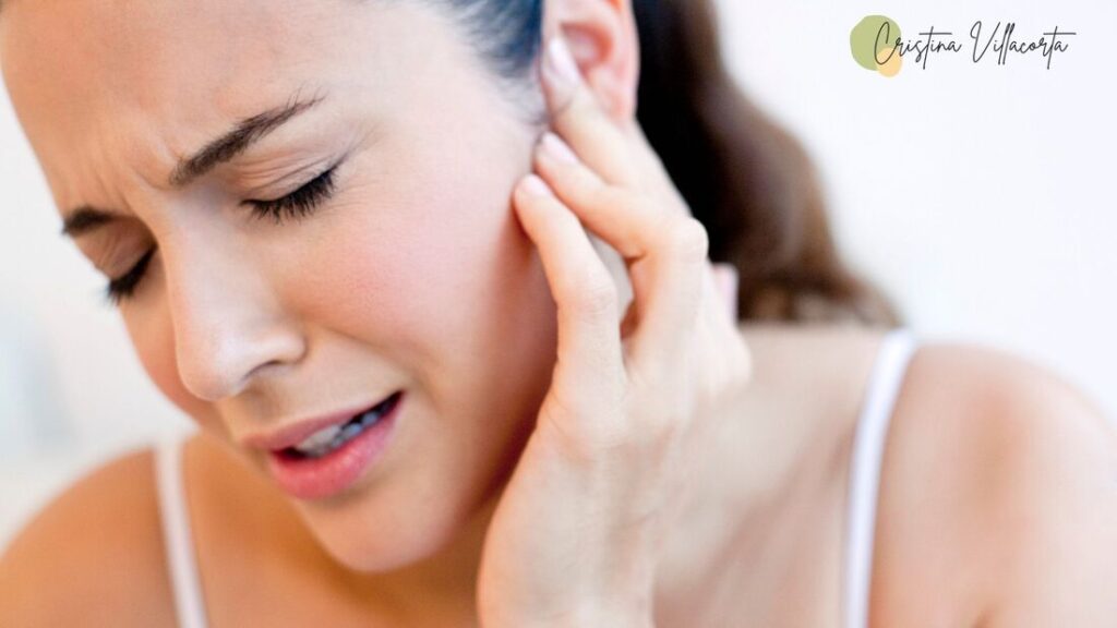 woman with an ear ache and the best homeopathic remedies to help her.