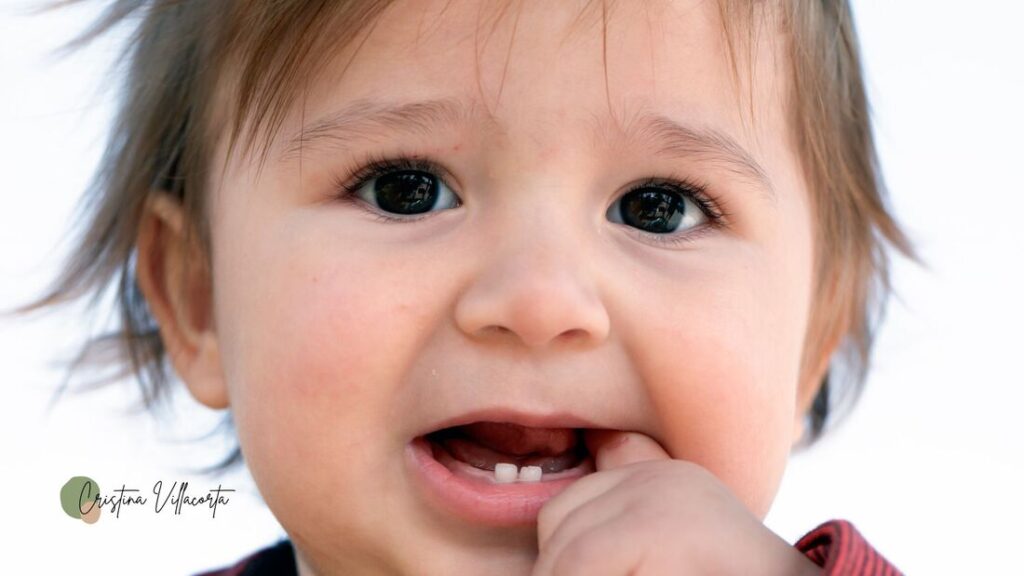 Baby teething waiting to receive homeopathic remedies.